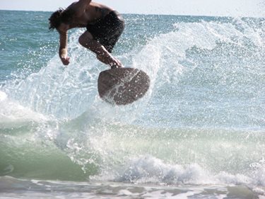 Skimboarding at the Cocoa Beach Pier